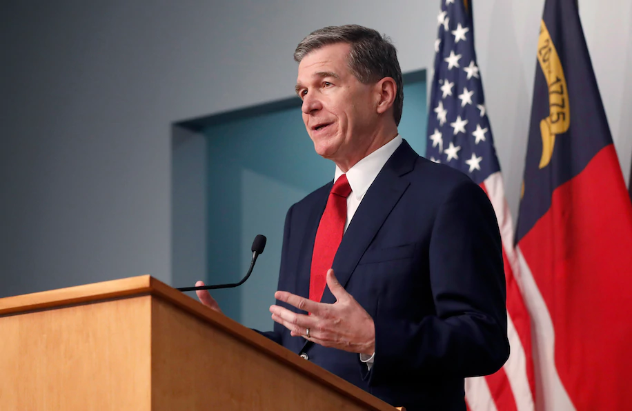 Gov. Roy Cooper answers a question during a briefing at the Emergency Operations Center in Raleigh, N.C.